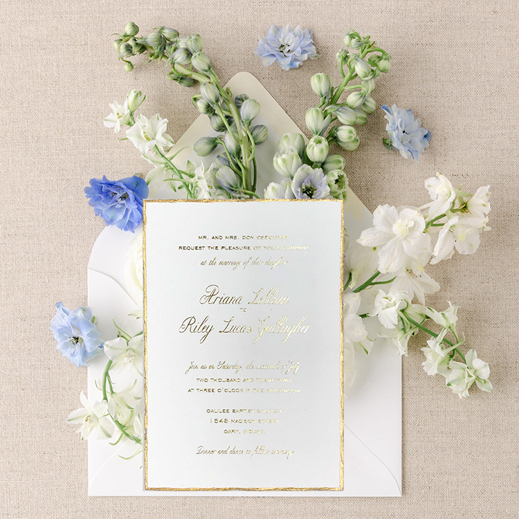 wedding invitation with gold foil edging and text