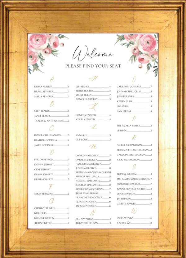 Soft pink flowers on a seating chart for a wedding or event