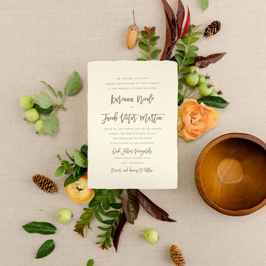 Natural edge wedding invitation sample with gold text